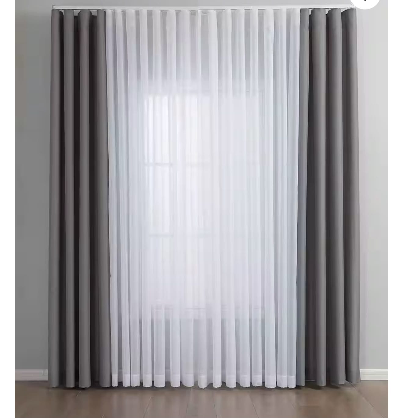 A set of floor-length curtains featuring two opaque gray panels framing a central white sheer pleated curtain.